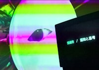 a tv with a colorful screen in front of it