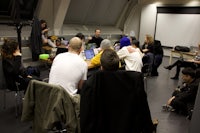 a group of people sitting around a table